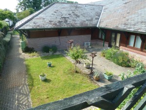 The view of Gossoms End garden from the terrace of the dining room. A good NHS facility
