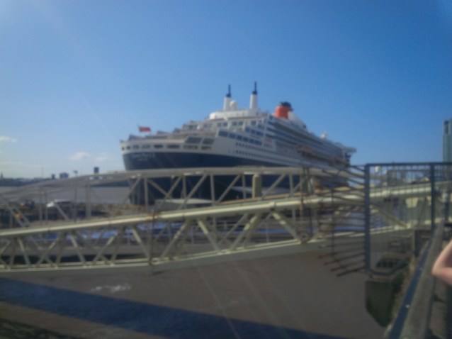 QM 2 at Liverpool at start of historic transatlantic crossing